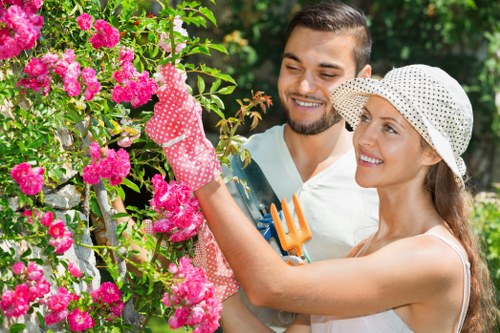 A gardener wearing protective gear while working outdoors